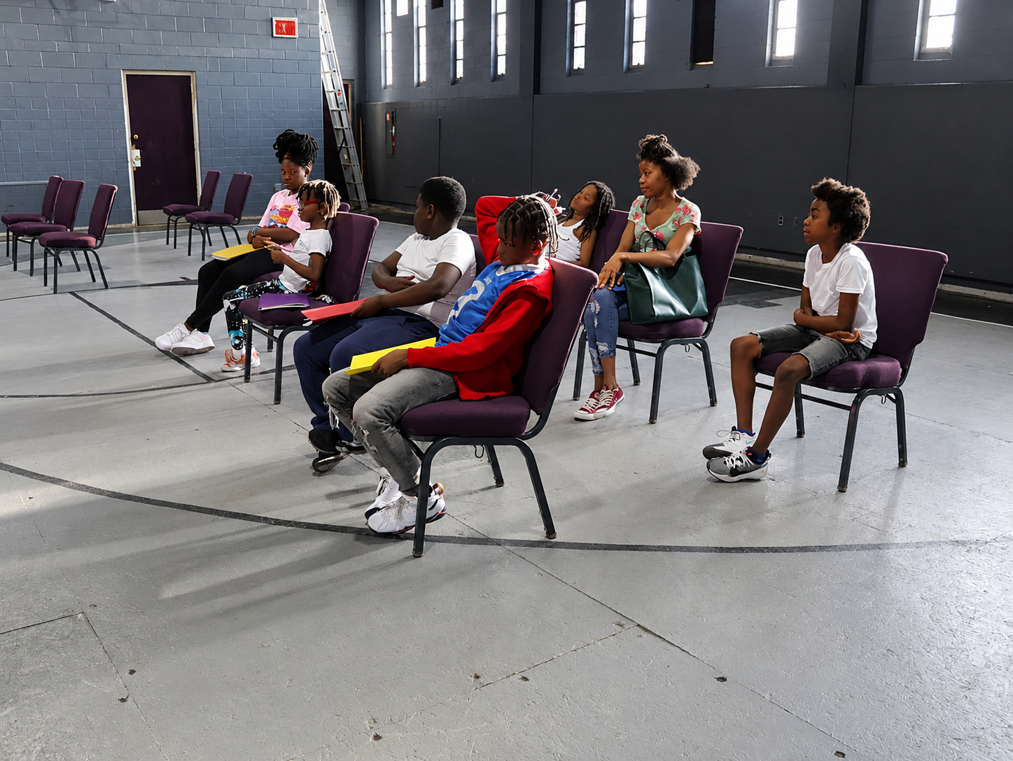 Youth gathered in a discussion circle