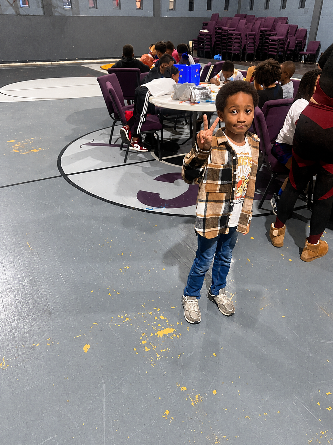 Young Detroit student giving peace sign